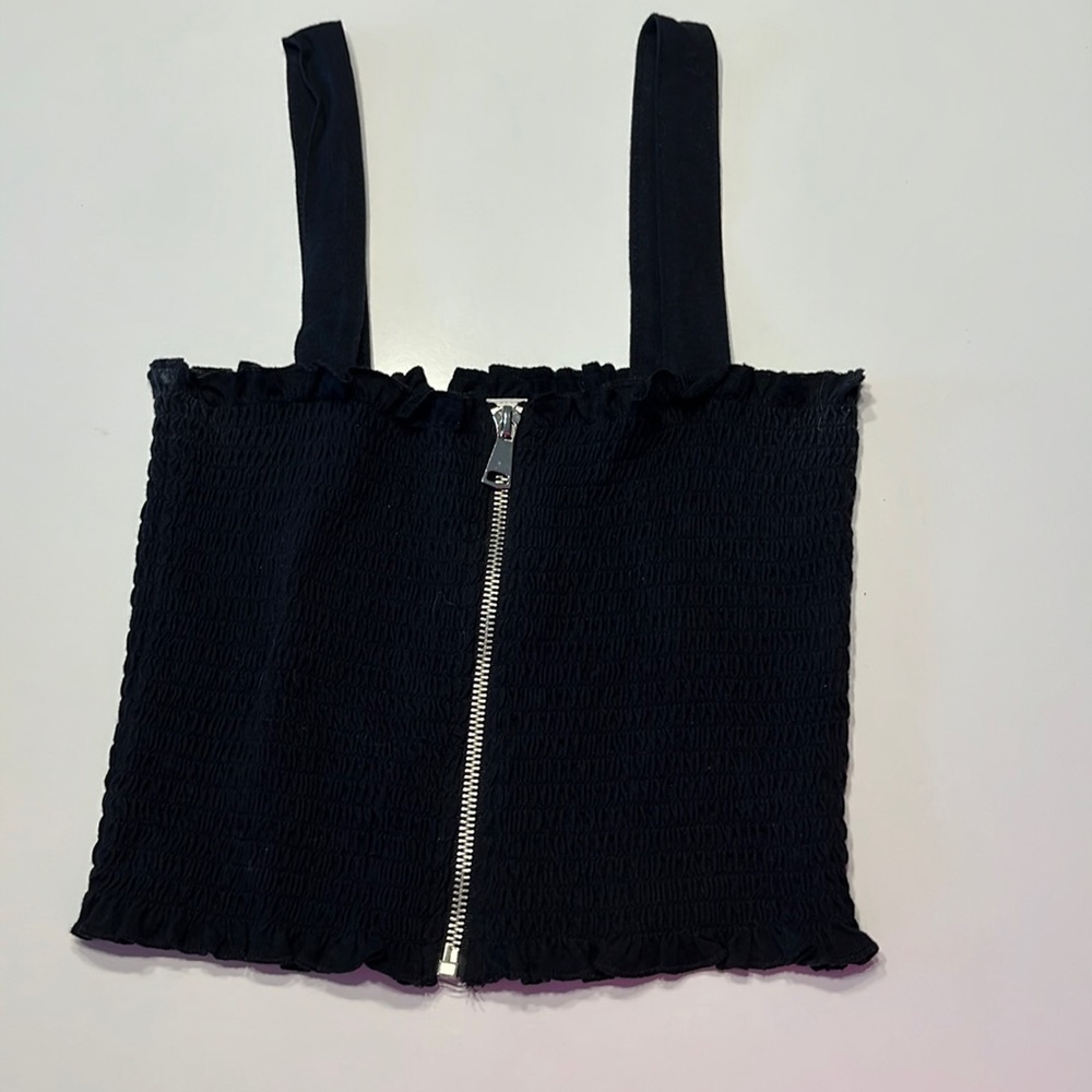 Black shirt. With zipper in the front
